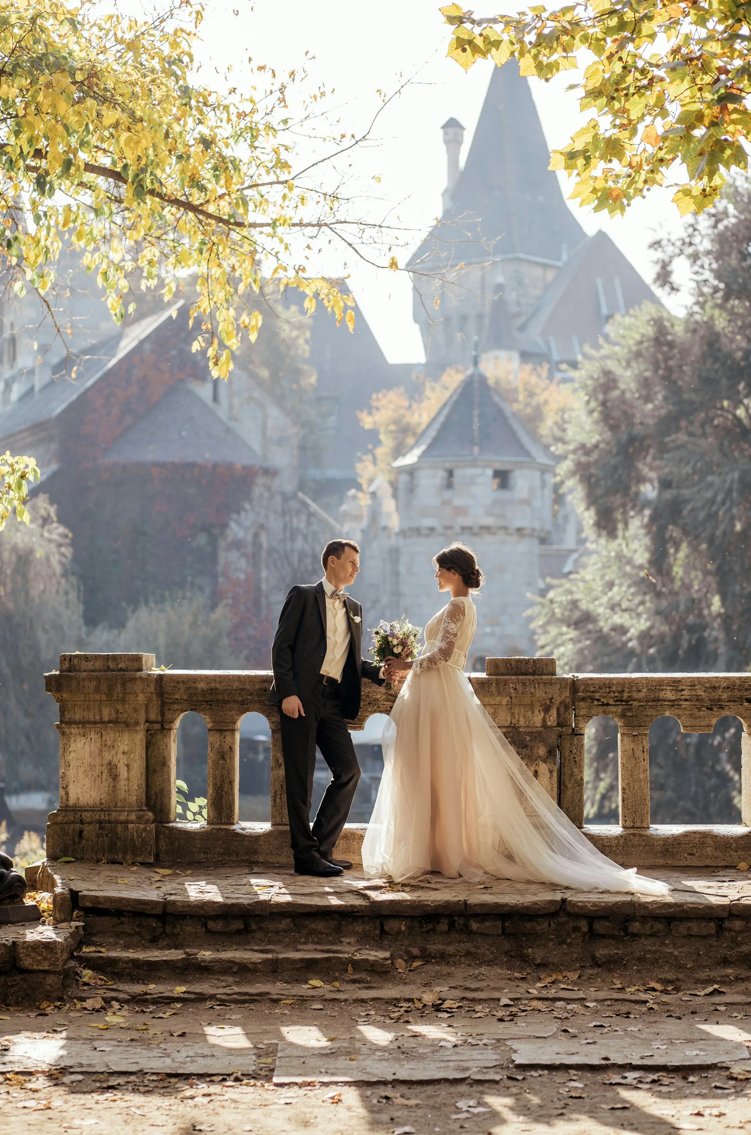 Newlyweds share a romantic dance under the evening sky.